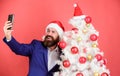 Capturing christmas memories. Man with beard and happy face send christmas greetings. Winter holidays concept. Santa