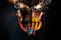 Close up of hands tied with chains and holi powder on black background Ai generative Royalty Free Stock Photo