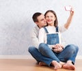 Capturing happy moments together. Happy young loving couple making selfie Royalty Free Stock Photo