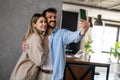 Capturing happy moments together. Happy young loving couple making selfie and smiling. Royalty Free Stock Photo