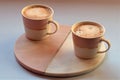 Valentine Cappuccinos, in blushed lighting. Royalty Free Stock Photo