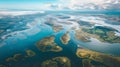 Capturing the mesmerizing patterns of meandering rivers amidst tidal flats, this image is a vibrant testimony to the Royalty Free Stock Photo