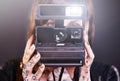 Capturing a moment. Studio shot of a young tattooed woman holding a vintage camera. Royalty Free Stock Photo