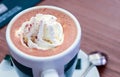 Capuccino in white cup with whiped cream and cinnamon Royalty Free Stock Photo