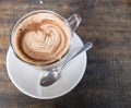 Capuchino or latte coffee in a cup with Spoon Royalty Free Stock Photo