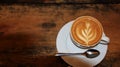 Capucino coffee in a cup on a wooden table Royalty Free Stock Photo