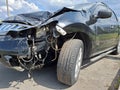 Car after an accident. Black car in wreck condition after road accident Royalty Free Stock Photo