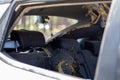 A car after an accident with a broken rear and side glass, view from the rear window. Broken window in a vehicle. The wreckage of