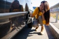 Car accident concept. woman in a state of shock talking on the phone after a car accident