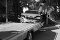 Car accident, head-on collision. Tow truck loads a wrecked car after an accident