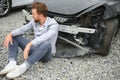 Car accident. Man after car accident. Man regrets damage caused during car wreck