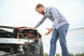 Car accident. Man after car accident. Man regrets damage caused during car wreck