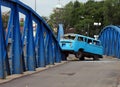 Car accident simulation with a van almost falling off the bridge