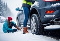 Car accident in winter, Woman waiting for help on the road after an accident on a snowy slippery road, following traffic rules, Royalty Free Stock Photo