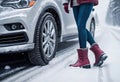 Car accident in winter, Woman waiting for help on the road after an accident on a snowy slippery road, following traffic rules, Royalty Free Stock Photo