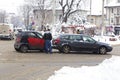 Car accident on a road covered with low amount of snow