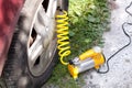 Car air compressor with yellow twisted hose