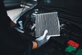 Car air conditioner system maintenance, Hand mechanic holding car air filter to check for clean dirty or fix repair heat have a Royalty Free Stock Photo