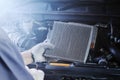 Car air conditioner system maintenance, Hand mechanic holding car air filter to check for clean dirty or fix repair heat have a Royalty Free Stock Photo