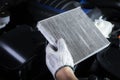 Car air conditioner system maintenance, Hand mechanic holding car air filter to check for clean dirty or fix repair heat have a Royalty Free Stock Photo