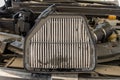 Car air filter replacement. changing a old air filter in cars engine Royalty Free Stock Photo