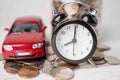 Car and alarm clock on coins, Car loan, Finance, saving money, insurance and leasing time. Royalty Free Stock Photo