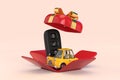 Car Alarm Remote Control with Yellow Cartoon Car in Opened Red Gift Box with Golden Ribbon. 3d Rendering Royalty Free Stock Photo