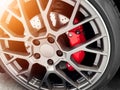 Car alloy wheel and tyre. New alloy wheel with tire and red carbon ceramic brakes. Alloy rim. Car wheel disc. Car spare parts Royalty Free Stock Photo