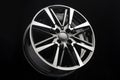 car alloy wheel, unusual design of wheel spokes, color black with polishing