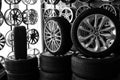 Car alloy wheels and tires in a store, selective focus. Sale and replacement Royalty Free Stock Photo