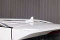 Car antenna on the roof of a white car for signaling gps, bluetooth Royalty Free Stock Photo