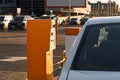 Car approaching to automatic barrier gates for supermarket parking lot. Security system for car park entry to shopping