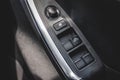 Car arm rest with Control Panel. Door Lock & Mirror Control. window adjustment buttons, door lock. Photography of a modern car. Royalty Free Stock Photo