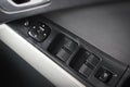 Car arm rest with Control Panel. Door Lock & Mirror Control. window adjustment buttons, door lock. Photography of a modern car. Royalty Free Stock Photo