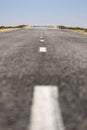 Car asphalt road in the middle of the hot empty Kazakh steppe