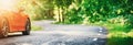 Red car on asphalt road in summer Royalty Free Stock Photo