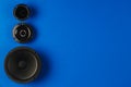 Car audio. Car speakers, bass speaker and midrange speaker lie in a row Royalty Free Stock Photo