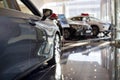 Car auto dealership.Themed blur background with bokeh effect. New cars at dealer showroom Royalty Free Stock Photo