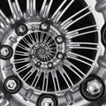Car automobile wheel rim spiral abstract metallic fractal background. Silver hex nuts, wheel spokes spiral effect pattern backgrou