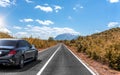 Car on the autumn road. Royalty Free Stock Photo