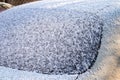 Car back window covered with snow. After snowfall Royalty Free Stock Photo