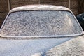 Car back window covered with snow. After snowfall Royalty Free Stock Photo