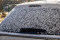 Car back window covered with snow. After snowfall Royalty Free Stock Photo