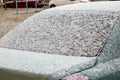 Car back window covered with snow. After snowfall Royalty Free Stock Photo