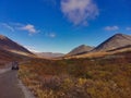 A car on the background of an autumn Arctic landscape in the Khibiny mountains. Kirovsk, Kola Peninsula, Polar Russia