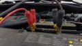 Car battery charging cords background