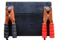 A car battery with red and black battery jumper clamps. Royalty Free Stock Photo