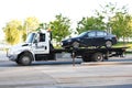 Car being towed by truck
