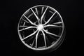 car black alloy wheel, elegant with thin curved spokes modern auto parts for car tuning Royalty Free Stock Photo