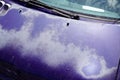 Car blue classic used peeling paint on grunge hood faded old by sun time Royalty Free Stock Photo